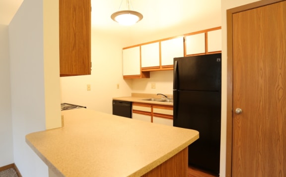 Image of a kitchen with cabinets and appliances