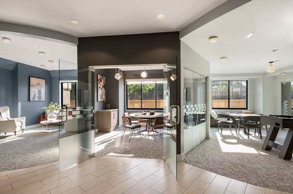 a kitchen with a granite counter top and a stainless steel refrigerator  at 15 Bank Apartments, NY, 10606