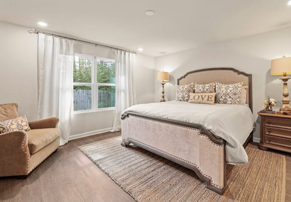 a bedroom with a bed and a couch
