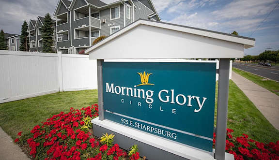 A sign for Morning Glory Circle in Sharpsburg stands in front of a building.