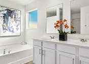 Thumbnail 6 of 6 - a white bathroom with two sinks and a mirror