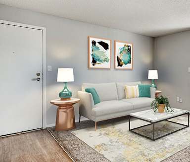 a living room with a couch and a table at Aspen Landing, Kansas City, Missouri