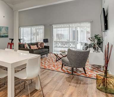 a living room and dining room with a white table and chairs at Aspen Landing, Kansas City, Missouri
