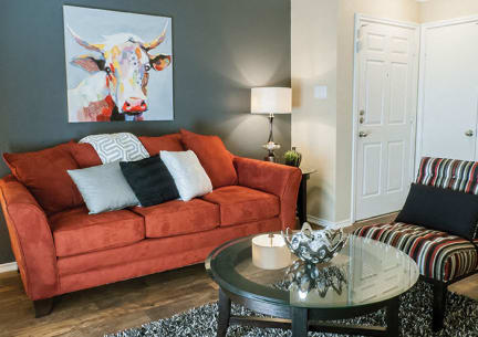a living room with a couch and a coffee table at Timberglen Apartments, Texas, 75287
