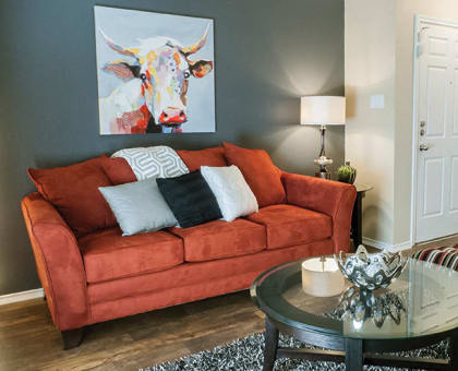 a living room with a couch and a coffee table at Timberglen Apartments, Texas, 75287