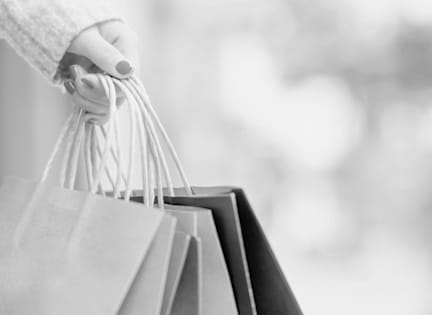 a person holding shopping bags