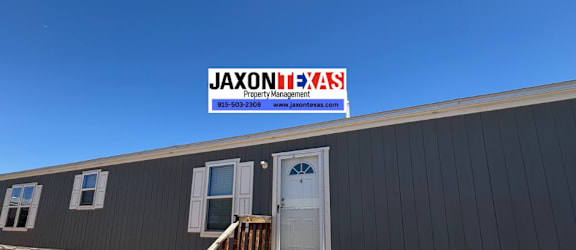 A building with a sign that says JAXON-EXAS Property Management.