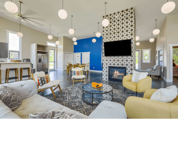 a living room with couches and chairs and a fireplace