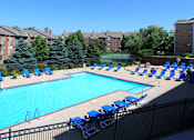 Thumbnail 28 of 44 - Apartments in central Lincoln Nebraska with beautiful landscaping, scenic views, large balconies, spacious balconies, huge swimming pool, and pool-side lounge chairs at Tanglewood Apartments