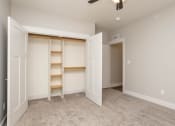 Thumbnail 36 of 48 - an empty bedroom with a closet and shelves