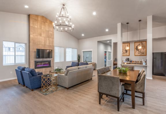 a living room and dining room with couches and a table