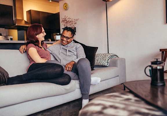 a man and a woman sitting on a couch