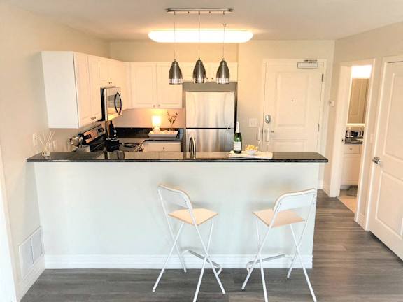 White cabinetry at Studio One Apartments, Michigan, 48201