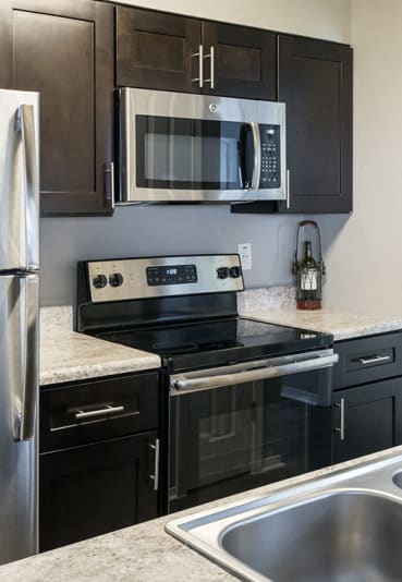 Fully-Equipped Modern Kitchen with Stainless Steel Appliances with Granite Countertops