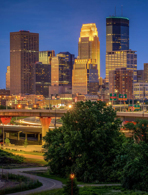 a view of the city skyline at dusk