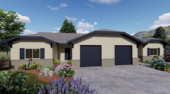 A modern house with a large front yard and a driveway.