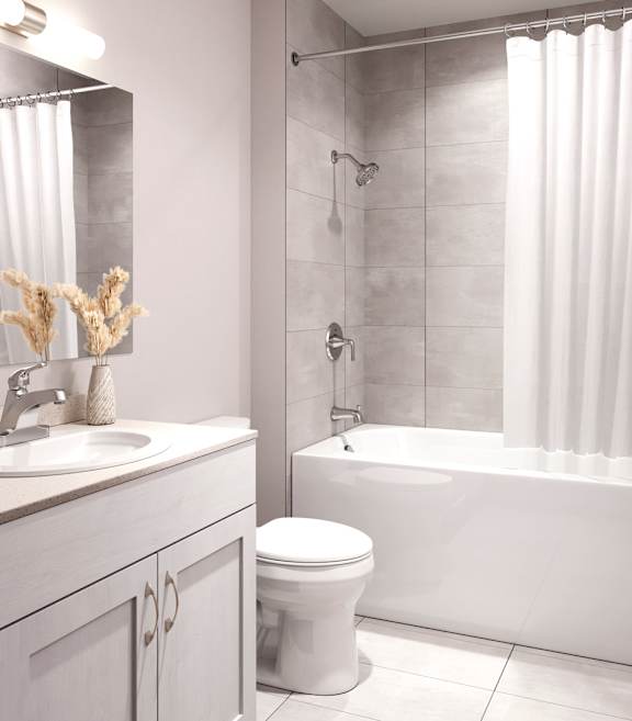 A white bathroom with a toilet at The Maverick Apartments, Ontario
