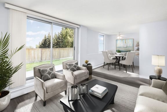 view of living room with 2 chairs a couch, and dining room and balcony with vinyl plank flooring.