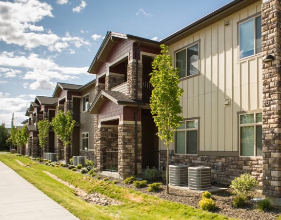 side of Vineyard at Eagle Promenade with stone and wood exterior