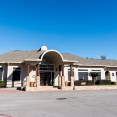 a large white building with a blue sky in the background