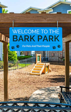 A sign that says "Welcome to the Bark Park" is displayed.