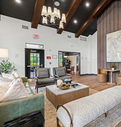 A living room with a large couch and a coffee table.