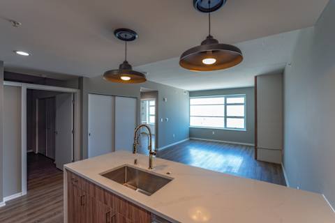A kitchen with a sink and a window.