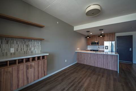 A kitchen with wooden cabinets and a countertop.