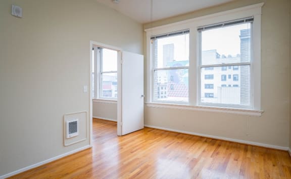 apartment interior with hardwood floors and city views at Maurice Dear Apartments, Portland Oregon