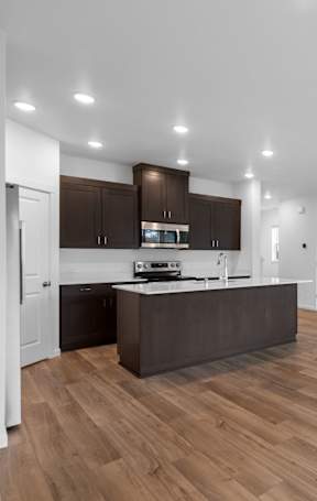 a kitchen with a large island in the middle of it
