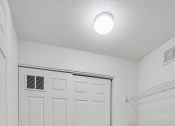 Thumbnail 10 of 22 - laundry room with washer/dryer and white doors and white floors