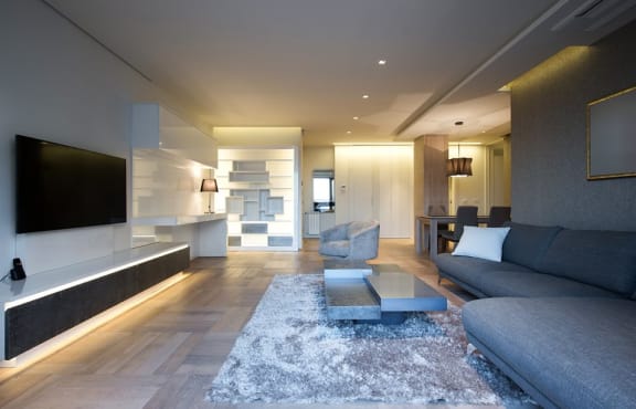 A  Large room with sofa set and flat tv