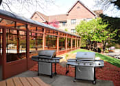 Thumbnail 8 of 14 - Two silver grills next to shaded terrace