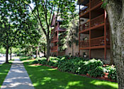 Thumbnail 11 of 14 - Outside apartment building with view of patio decks