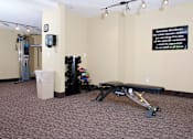 Thumbnail 6 of 14 - Fitness room with weight bench