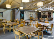 Thumbnail 16 of 25 - Community room with half a dozen game tables