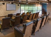 Thumbnail 18 of 25 - Theater room with a projector and three rows of viewing chairs