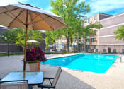 Thumbnail 19 of 25 - Outdoor pool with umbrella tables