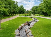 Thumbnail 25 of 25 - Stone water feature along a promenade/bike trail
