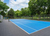 Thumbnail 21 of 25 - Blue outdoor tennis court