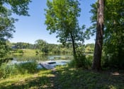Thumbnail 13 of 23 - trees and the lake with a small wooden dock