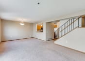 Thumbnail 6 of 22 - lit living room with view of the stairs and kitchen