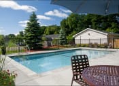 Thumbnail 17 of 22 - outdoor pool with deck chair and table with umbrella