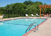 Thumbnail 13 of 17 - Outdoor pool with sun terrace and lounge seating