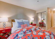 Thumbnail 4 of 22 - Bedroom with red comforter on the bed
