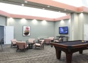 Thumbnail 14 of 22 - Game room with a black pool table