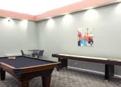 Thumbnail 15 of 22 - Game room with a black pool table