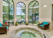 Thumbnail 6 of 22 - Indoor jacuzzi next to three tall windows