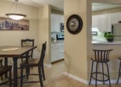 Thumbnail 2 of 22 - Kitchen and dining room with table and seating
