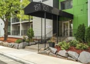 Thumbnail 6 of 19 - apartment entrance with a black awning that reads "151 on 8"